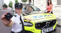 Rosie Leech of the PSNI and Minister Nichola Mallon pictured beside a police car