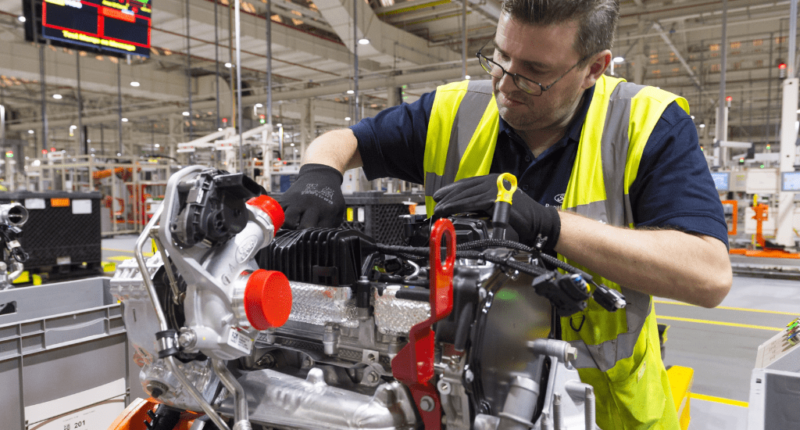 A man assembles an engine at a Ford plant in the UK
